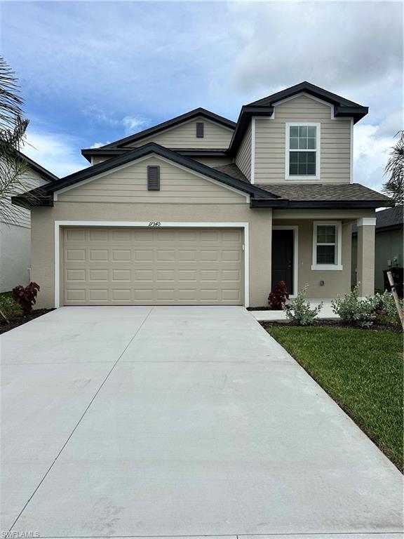 View of front of property with a garage