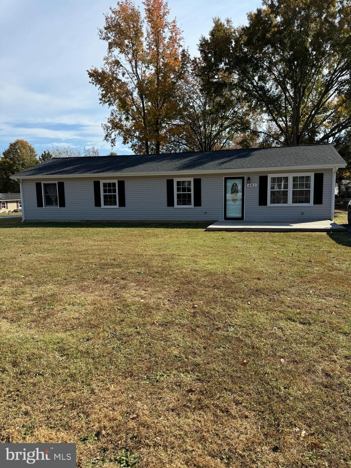 a house that has a big yard in front of it