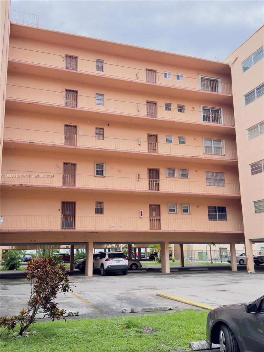 a view of a building with many windows in front of it