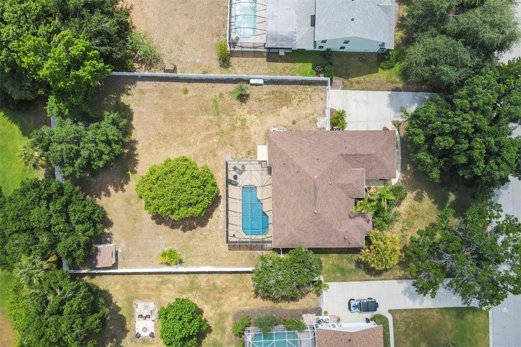 an aerial view of residential house with outdoor space and swimming pool