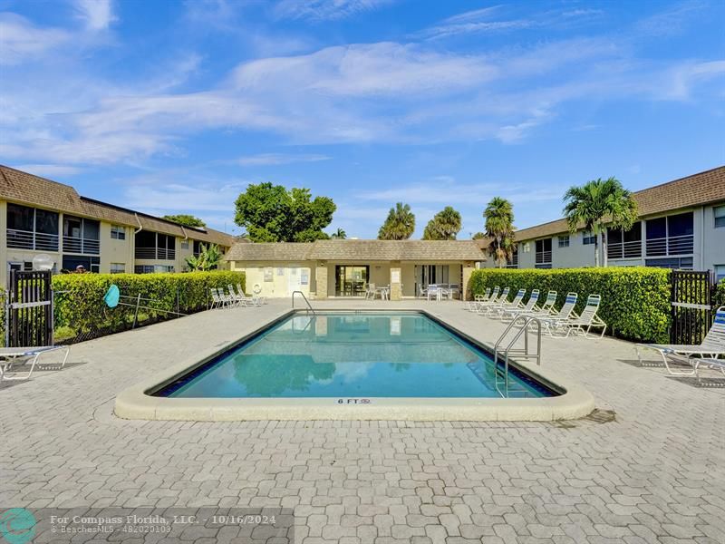 a view of swimming pool with outdoor seating