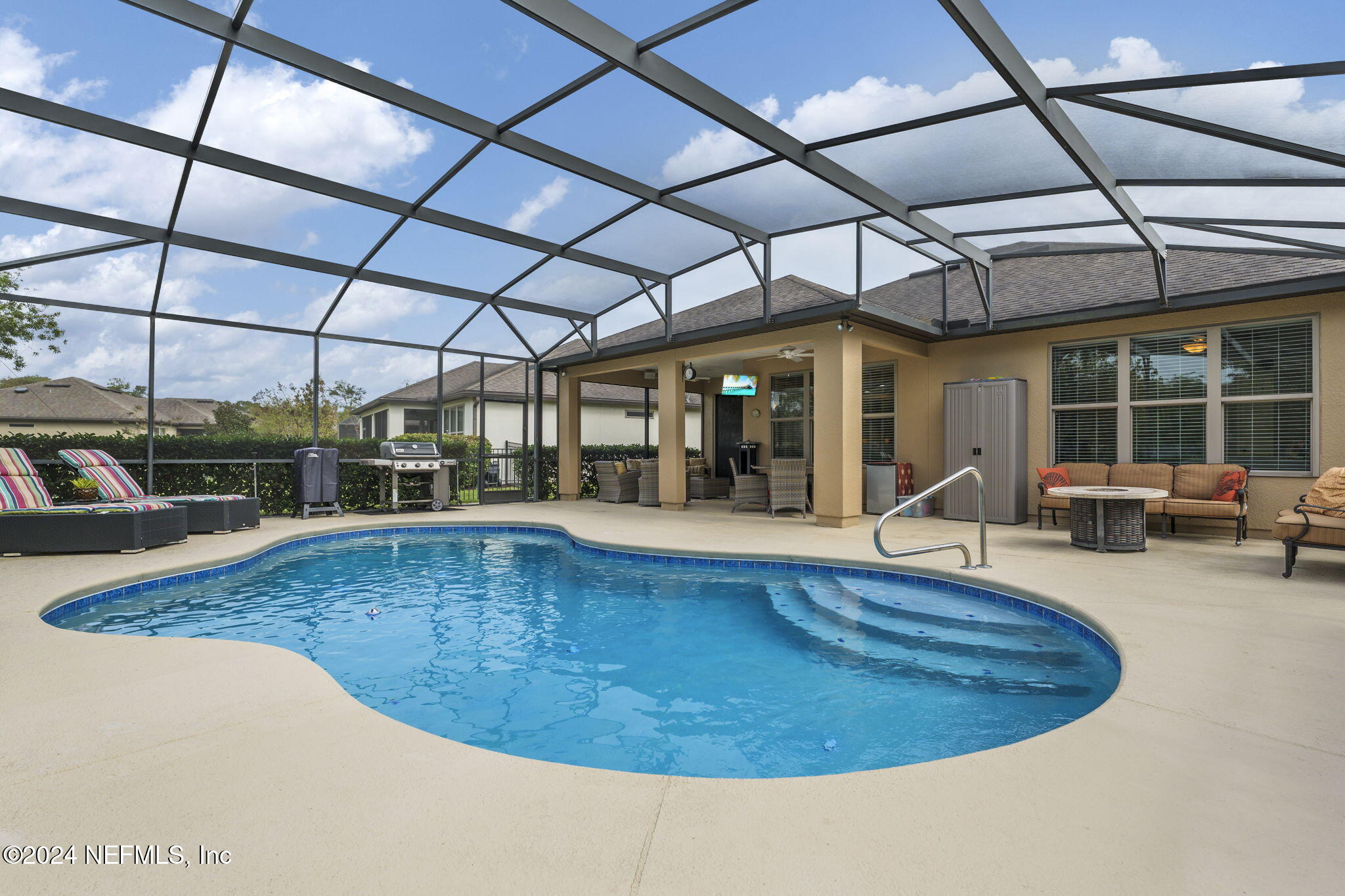 a view of a swimming pool with a patio