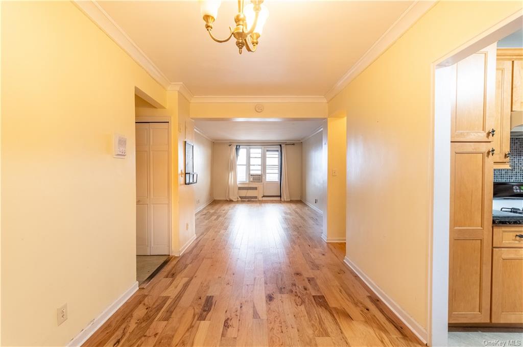 a view of hallway with wooden floor