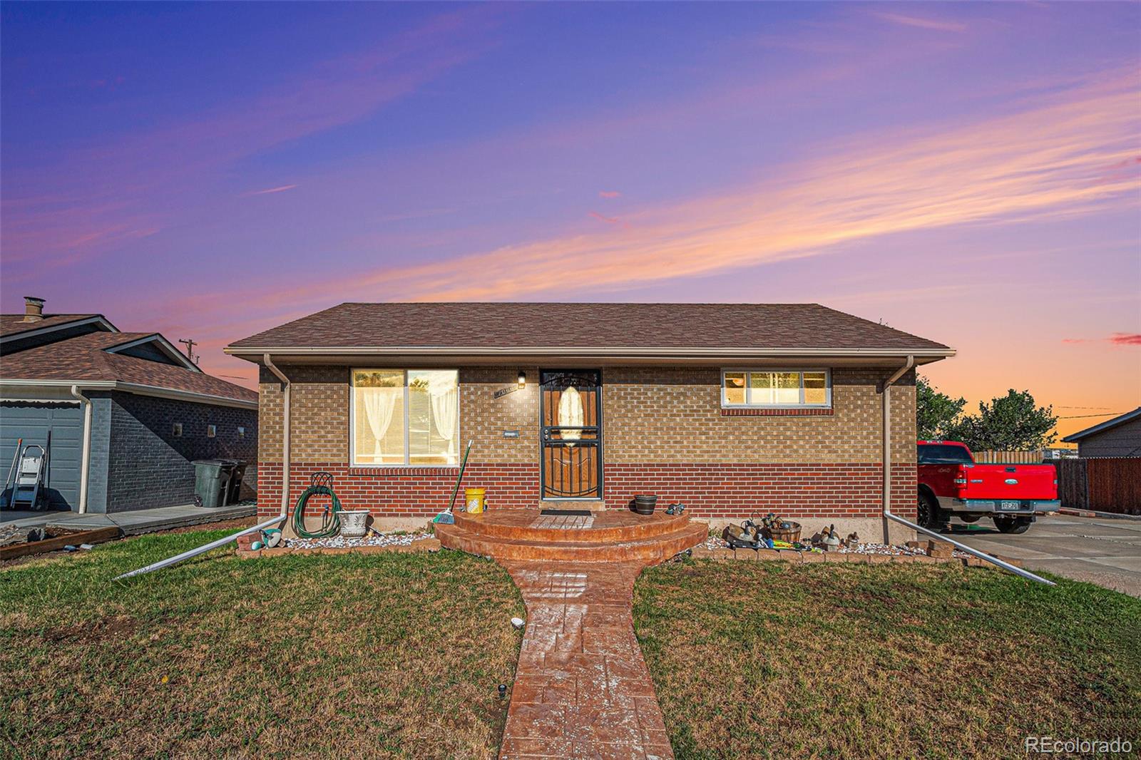 a front view of a house with a yard