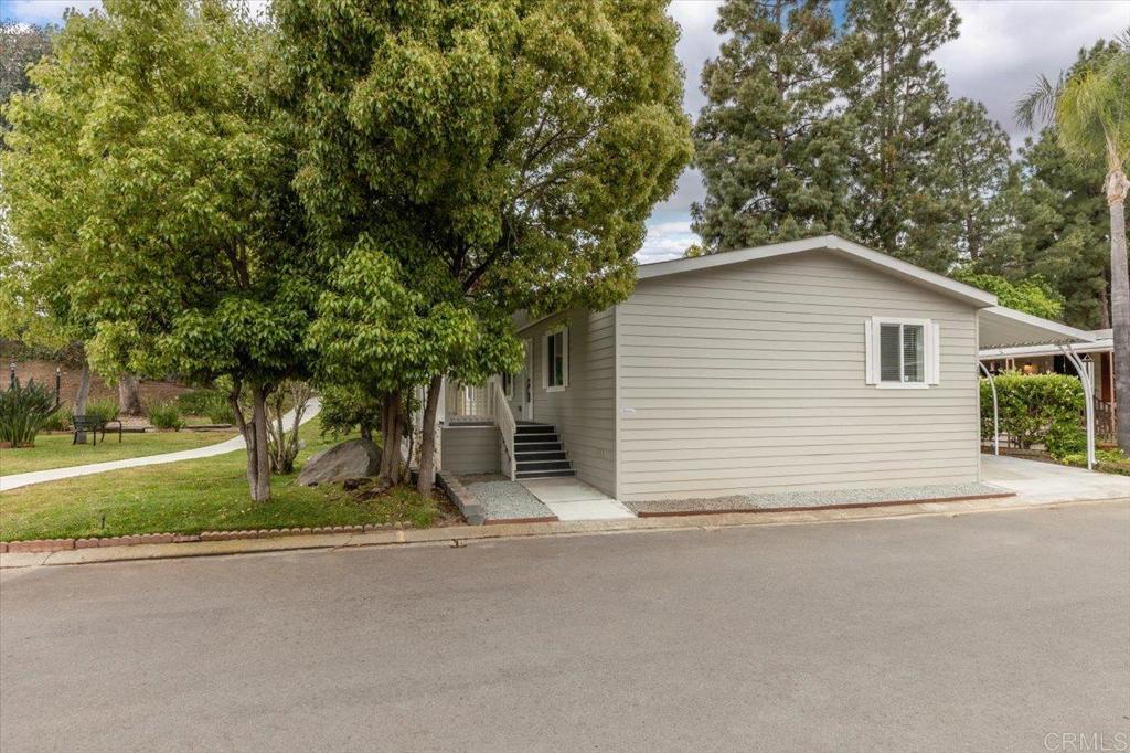 a view of a house with a yard and garage