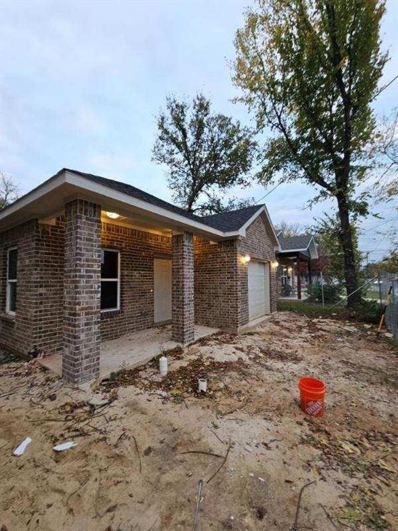 a front view of a house with yard