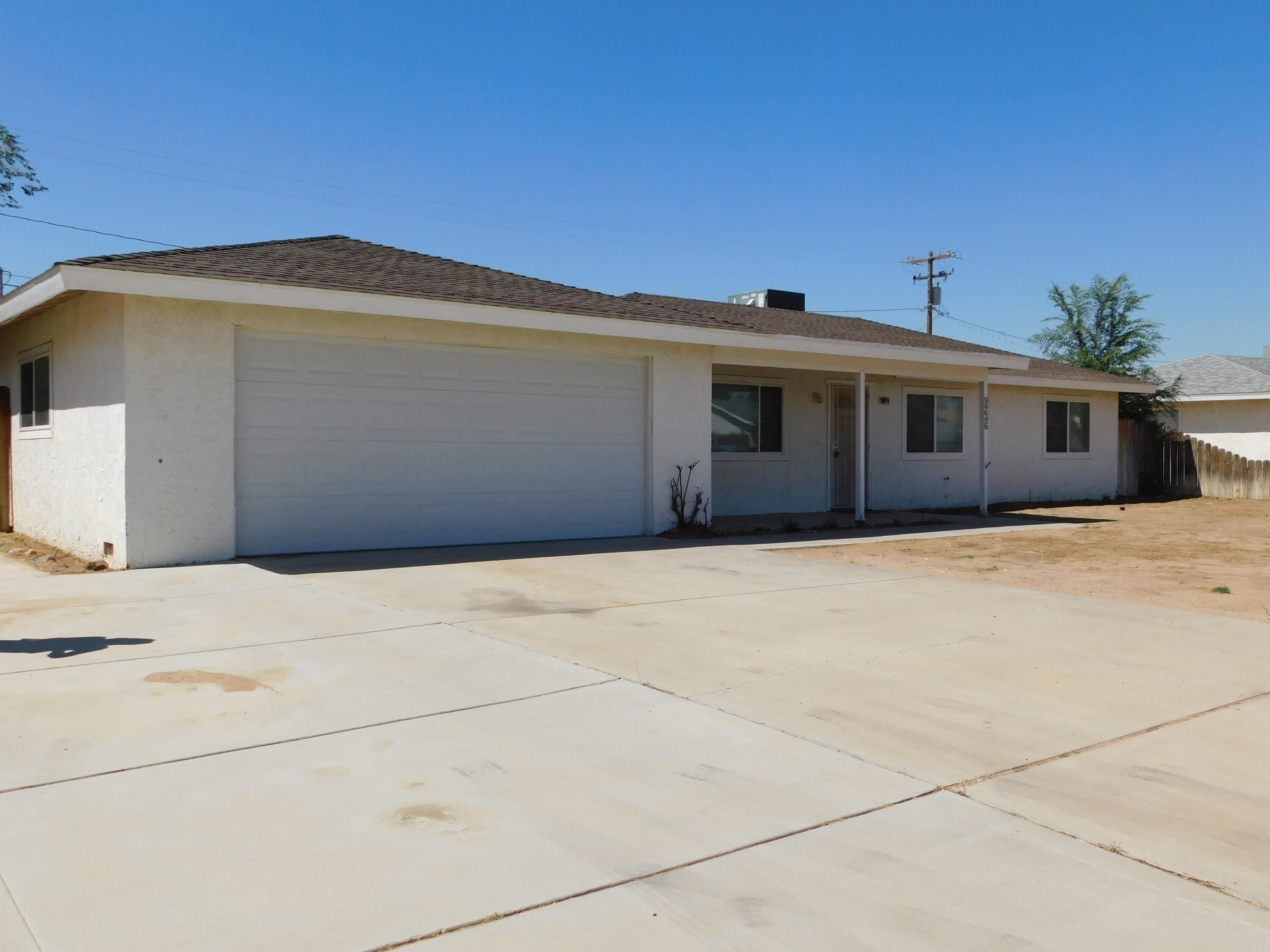 a front view of a house with a garage