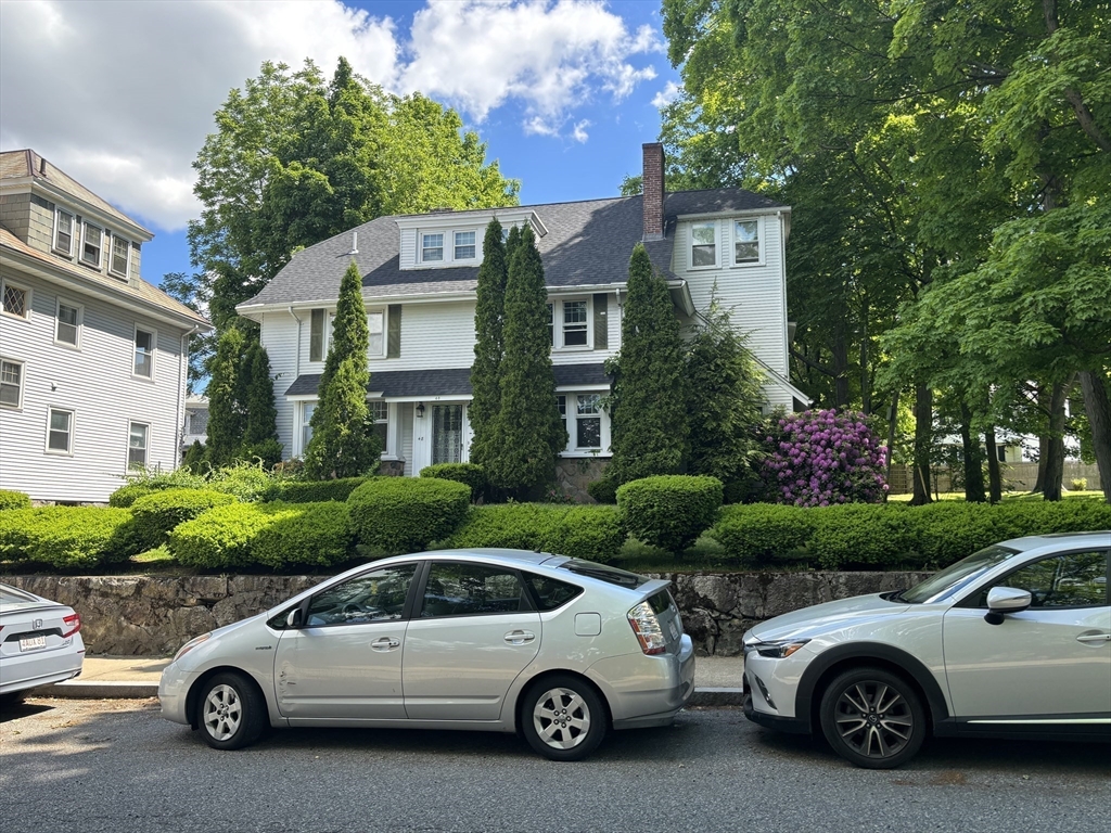 a car parked in front of a house