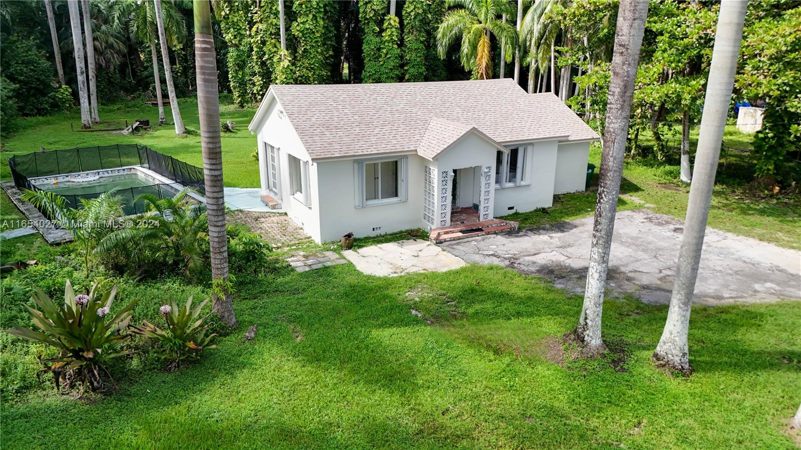 a view of a house with a yard porch and sitting area