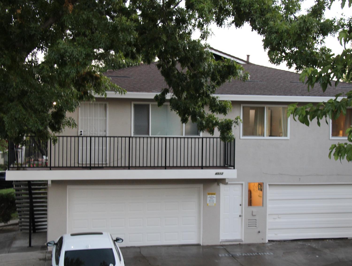 a view of balcony with deck and outdoor seating