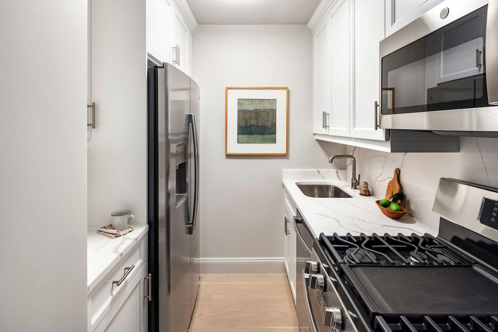 a kitchen with a stove and a refrigerator