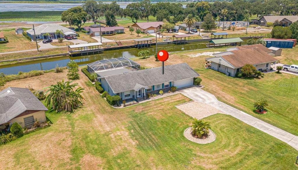 Exterior of the home showing the canal that leads to Lake Toho and the Kissimmee chain of lakes