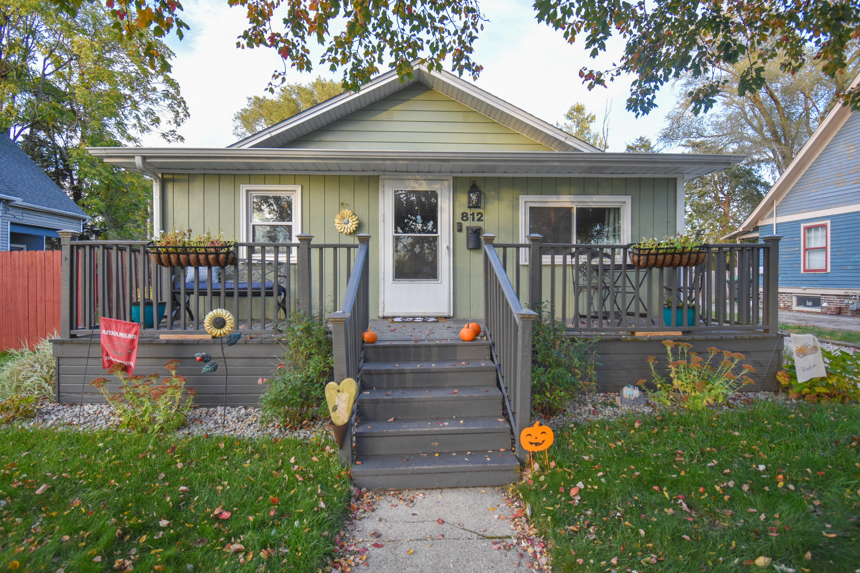 a front view of a house with garden and patio