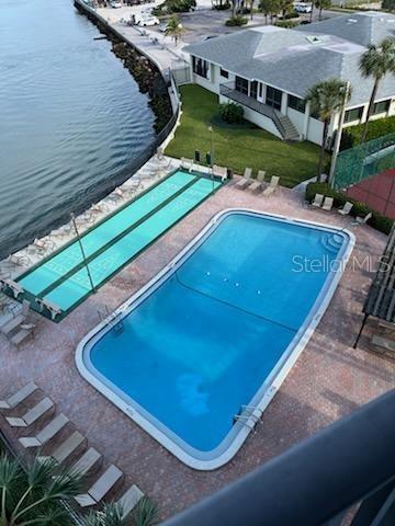 a view of a pool with a yard