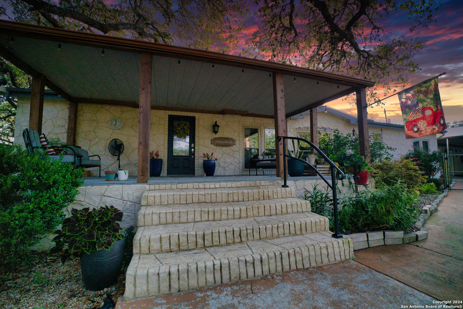 a view of a chair and table in the patio