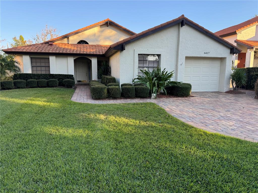 front view of a house with a yard