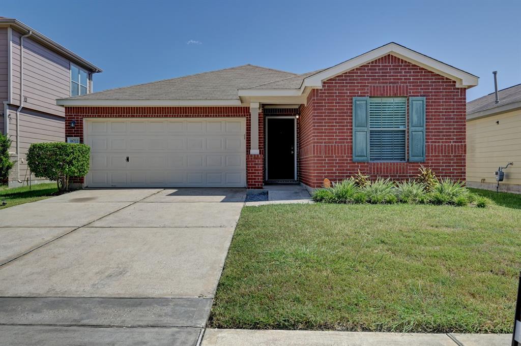 front view of a house and a yard