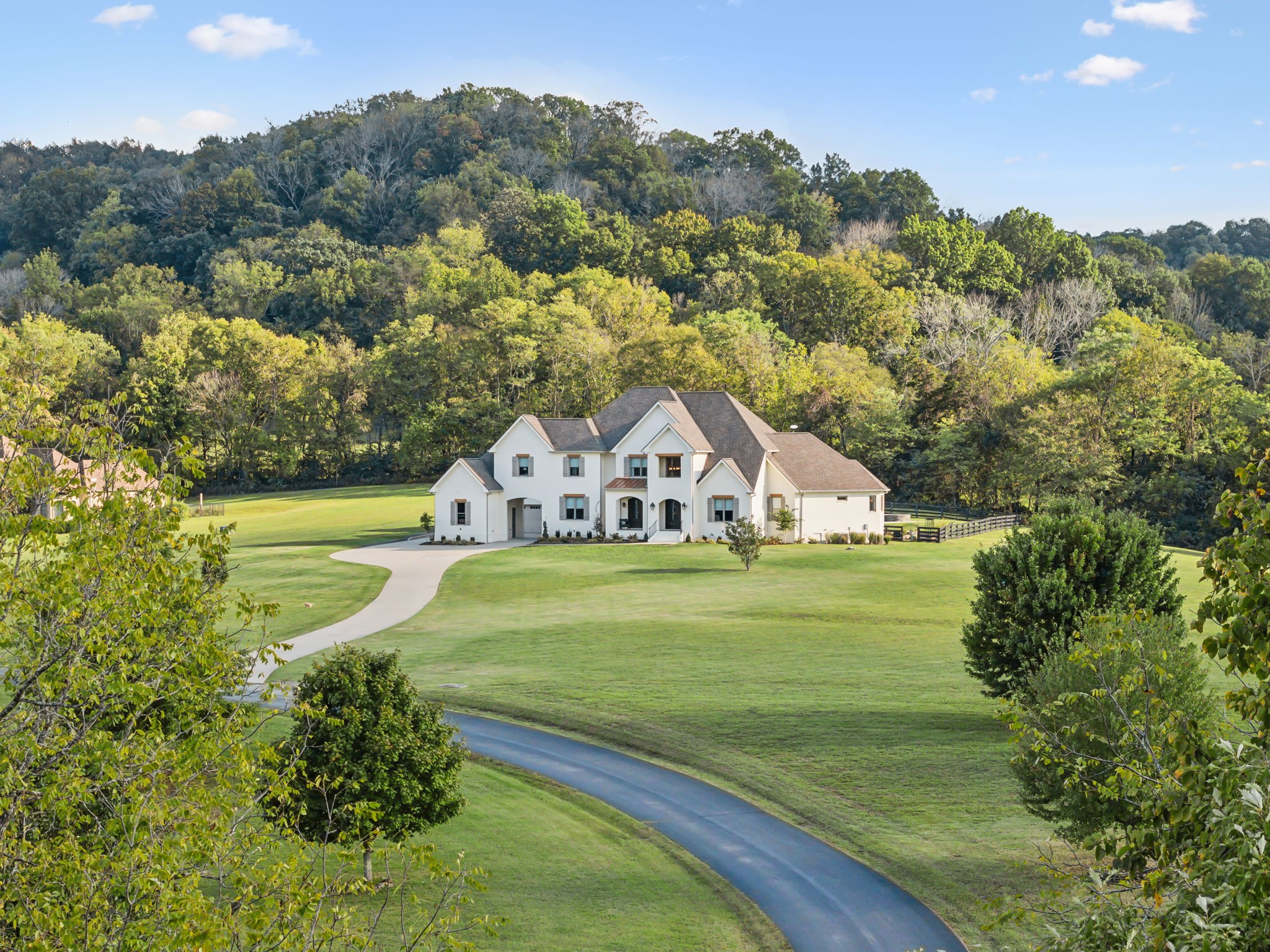 a view of a house with a big yard