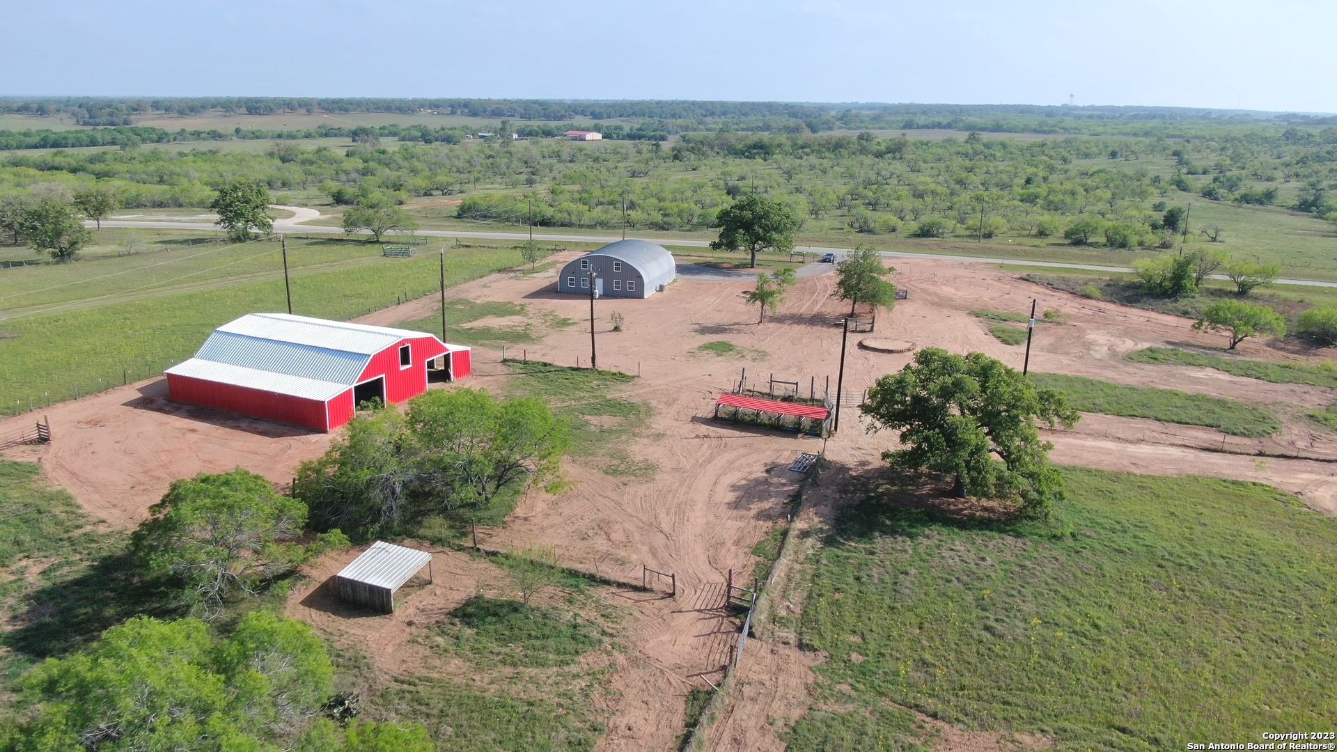 an aerial view of a house with outdoor space