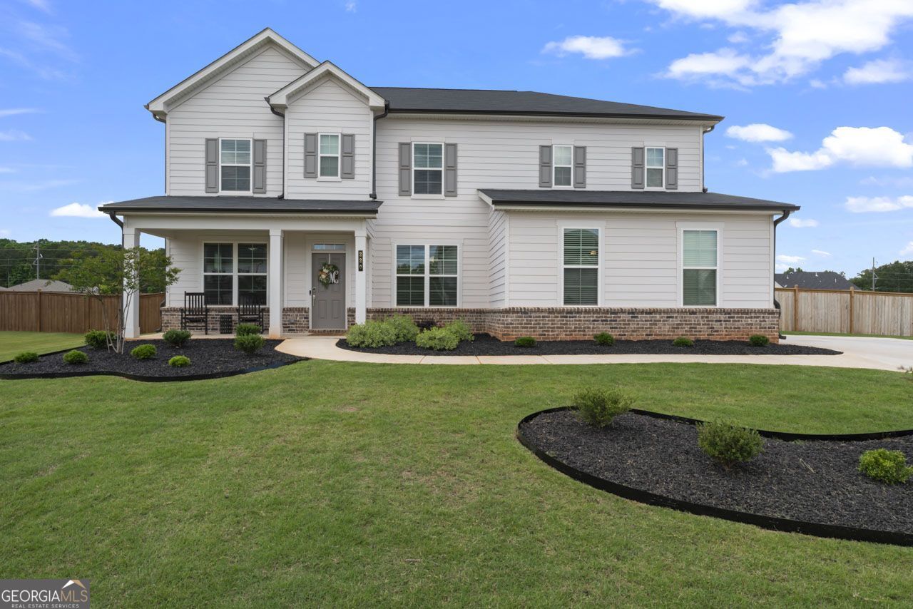 a front view of a house with a yard