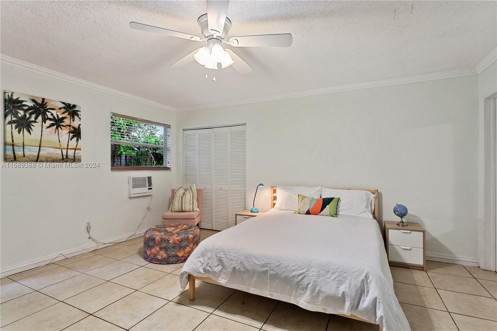 a bedroom with a bed and window