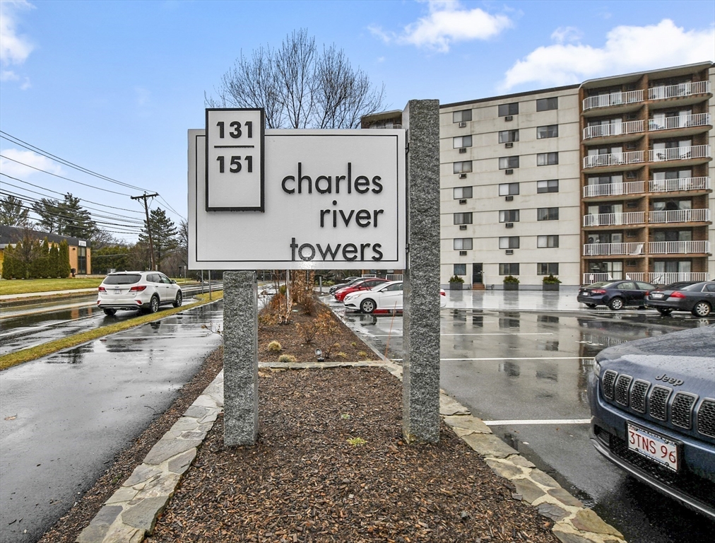 a view of a city street with tall buildings