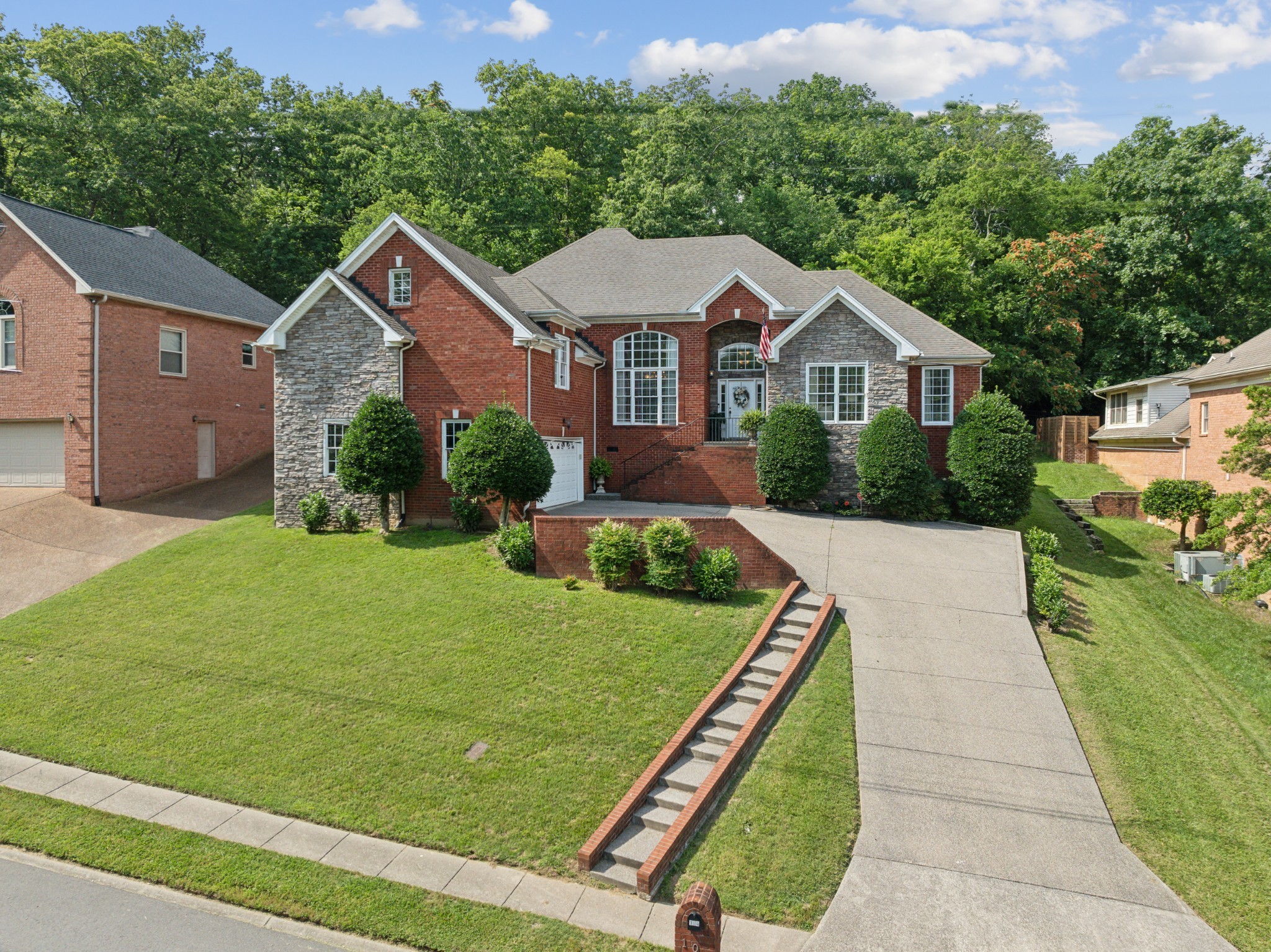 a front view of a house with garden