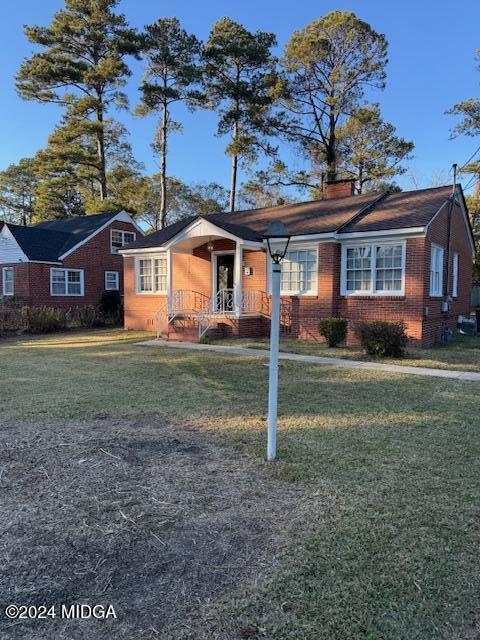 a front view of a house with a yard