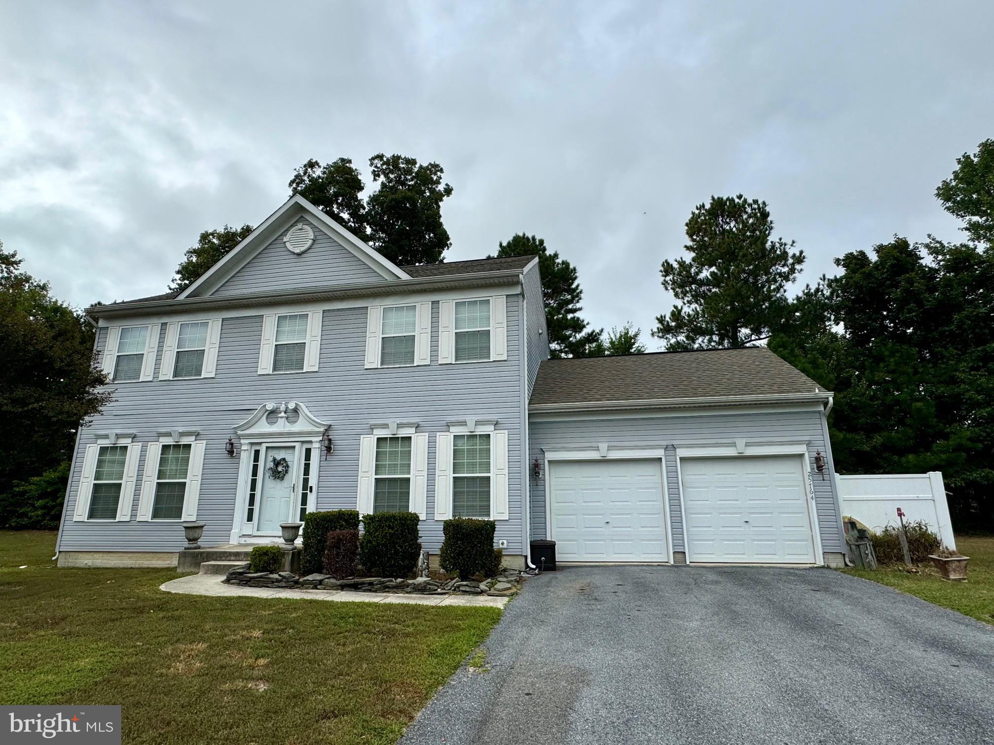 front view of a house with a yard