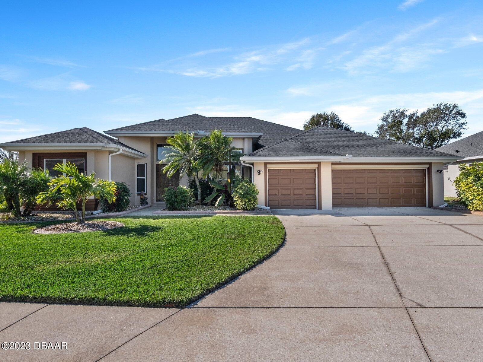 front view of a house with a yard