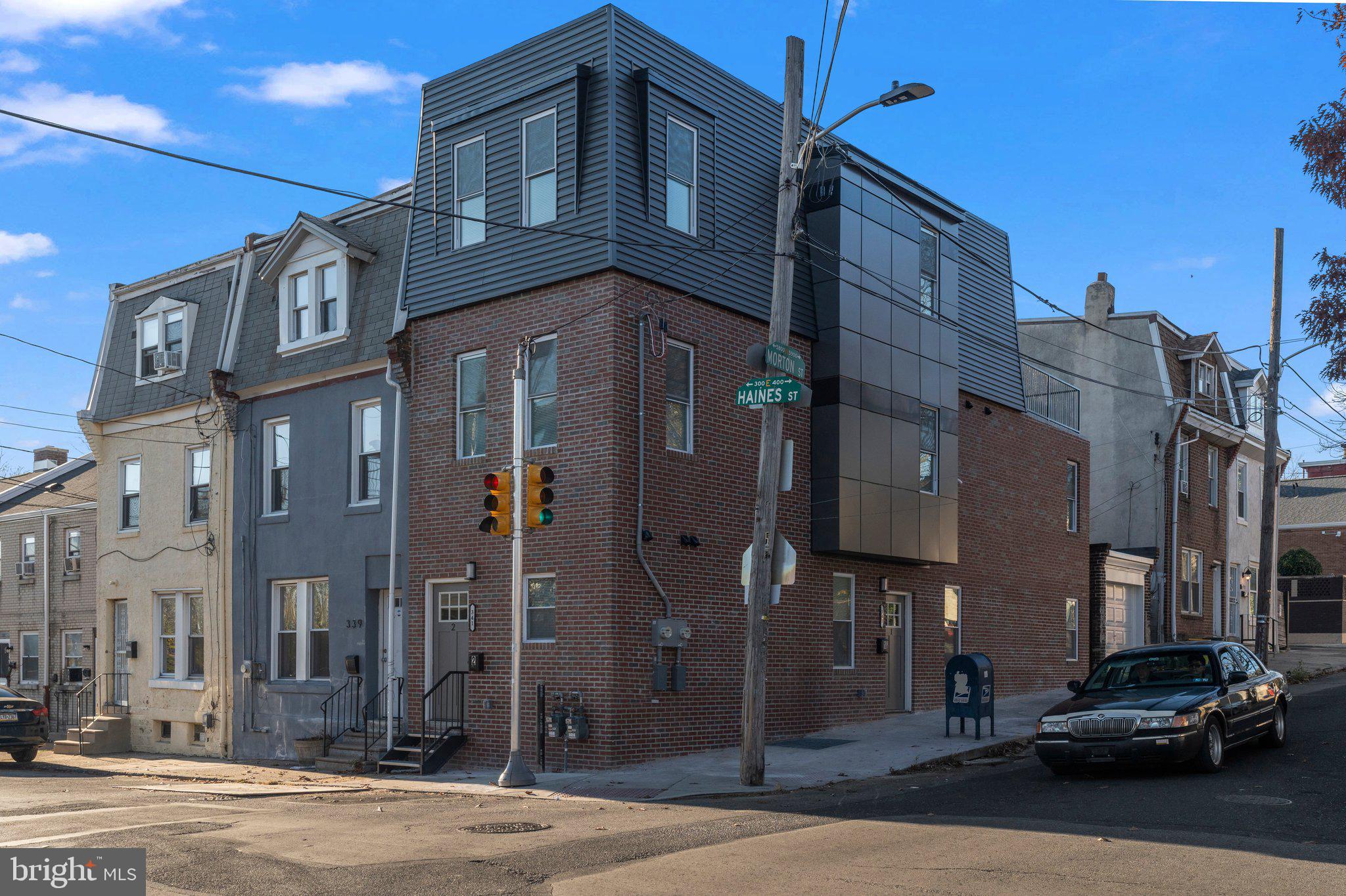 a couple of cars parked in front of a building