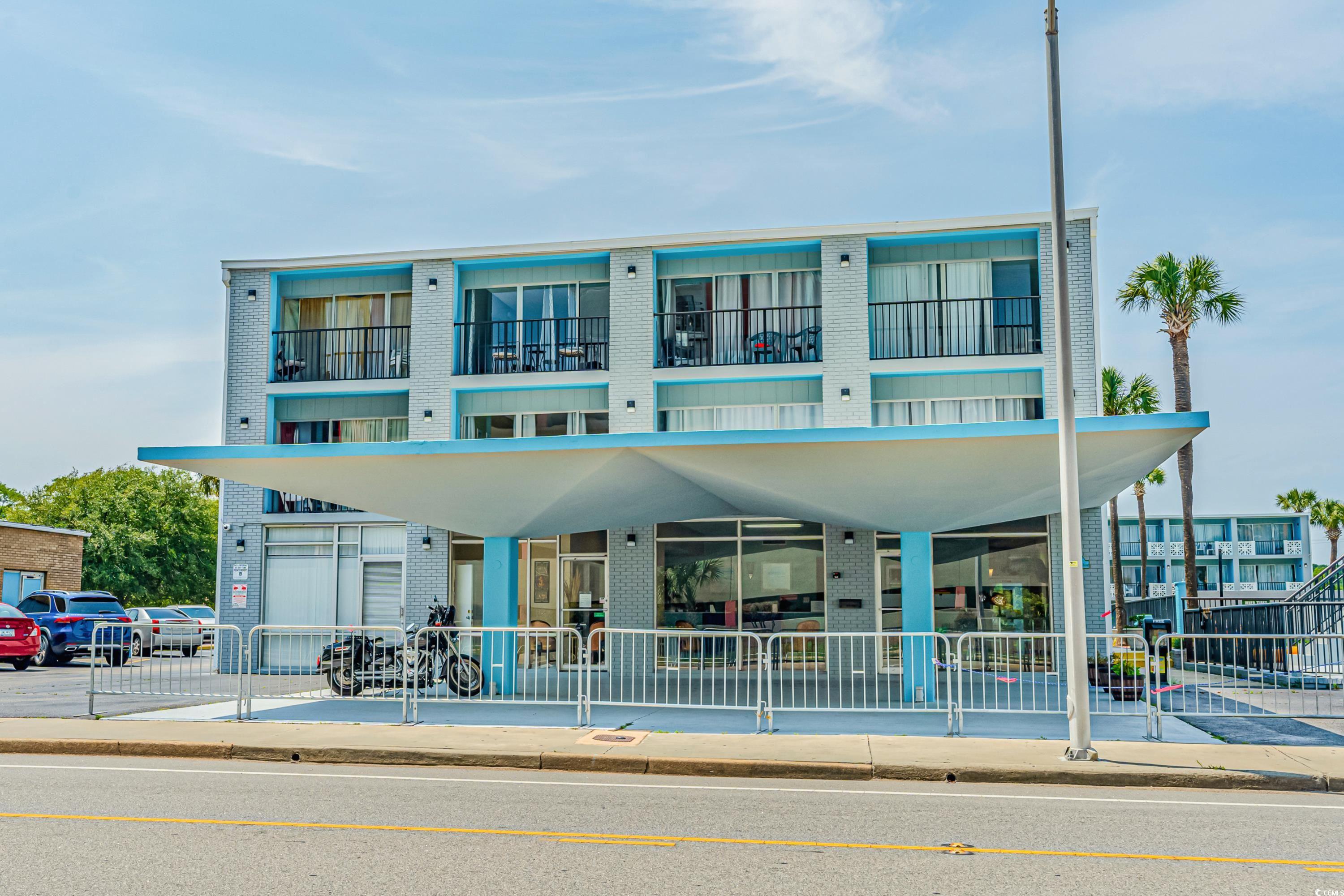 View of front of home with a balcony