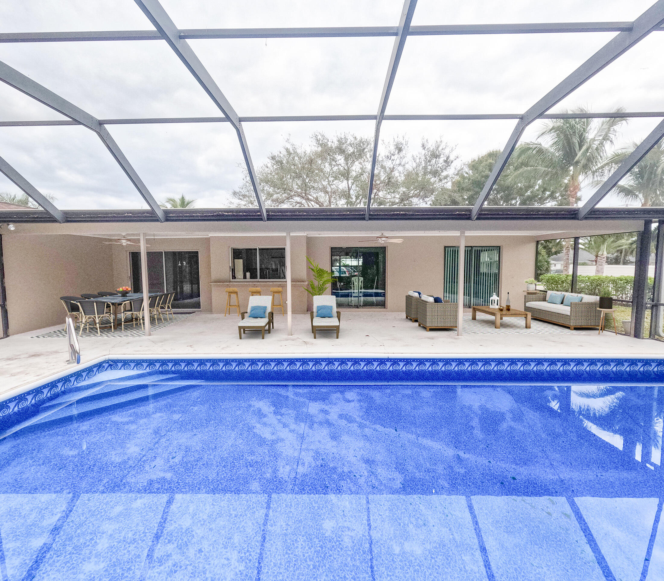 a swimming pool with outdoor seating