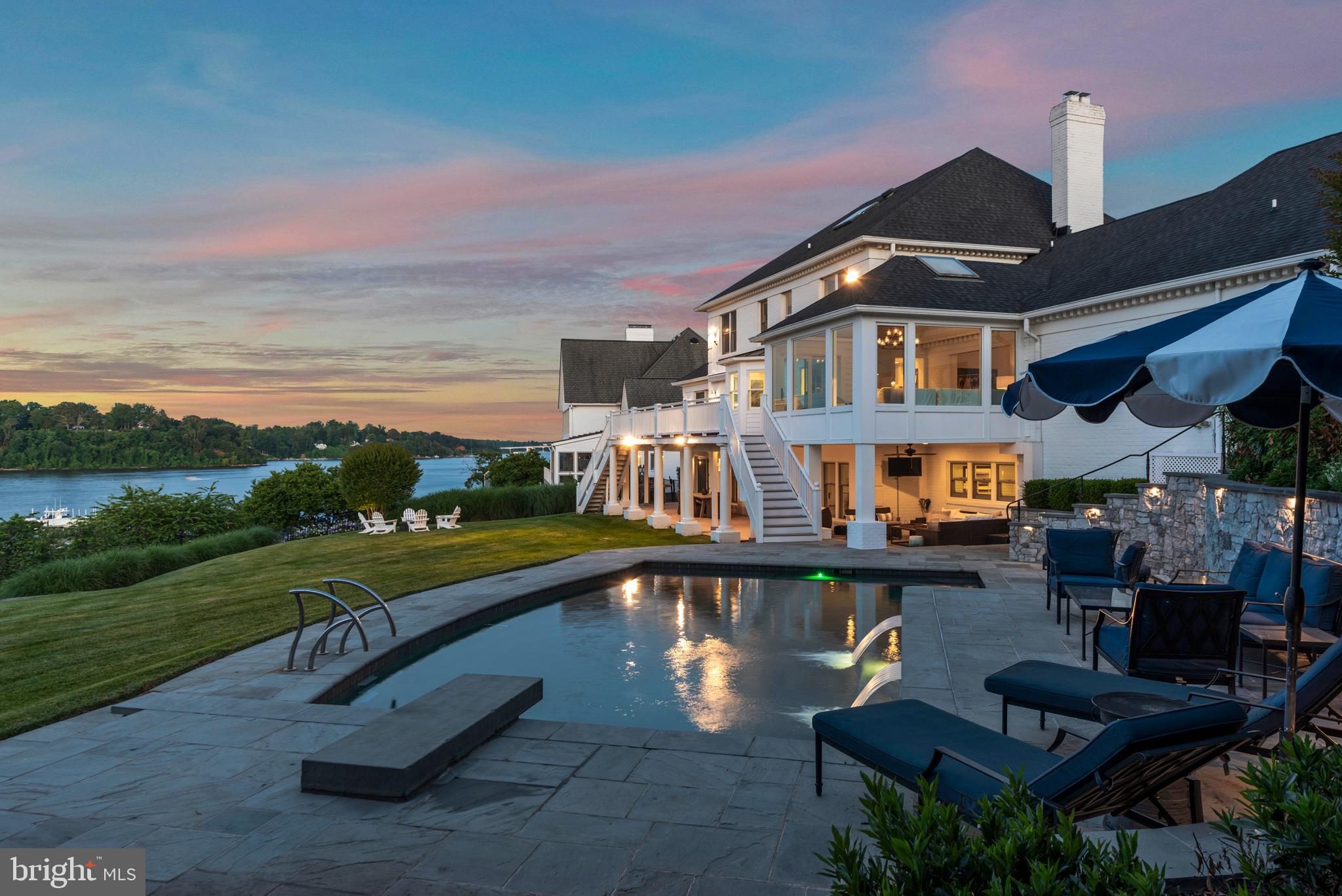 a swimming pool view with a outdoor seating