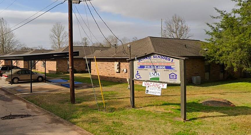 a sign board on the side of the road