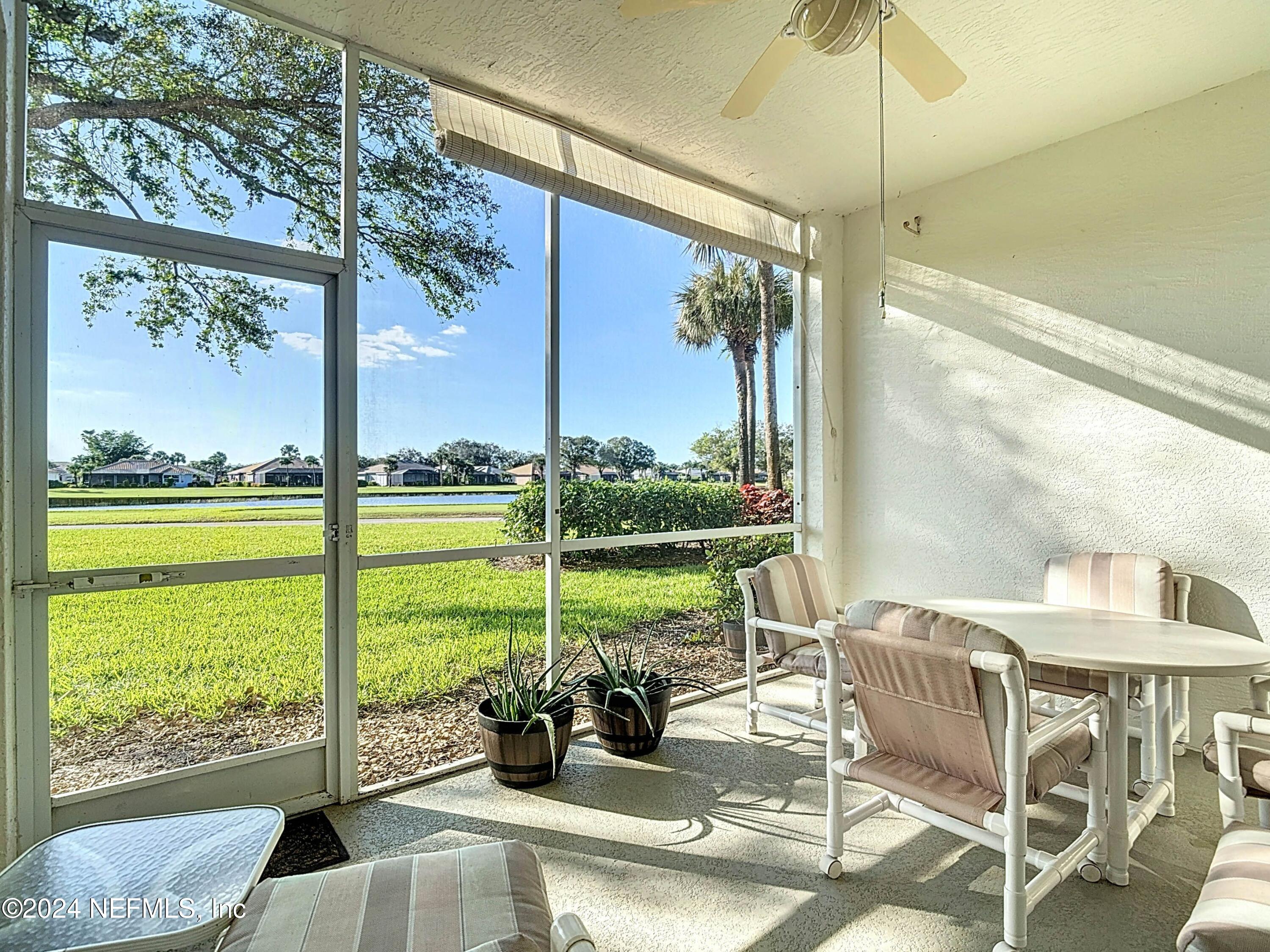 a view of a room with balcony and furniture