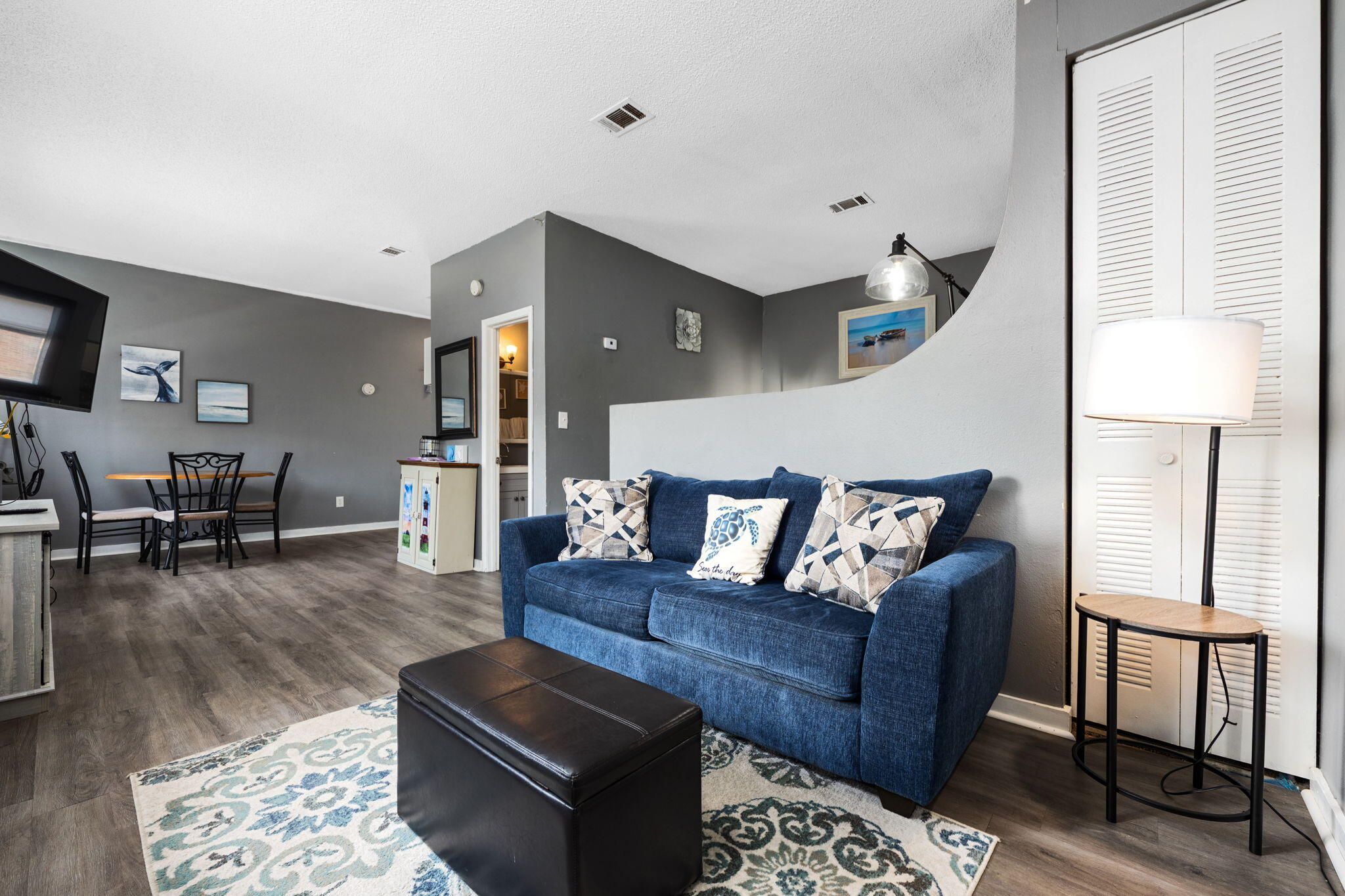 a living room with furniture and a table