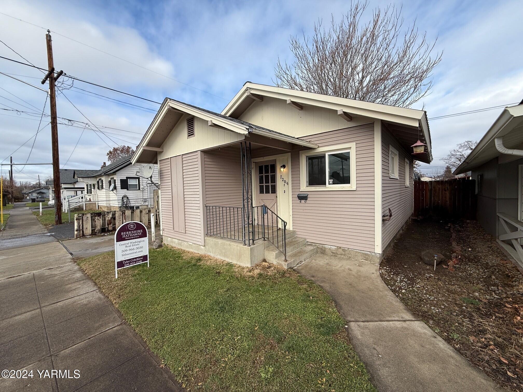 a front view of a house with garage