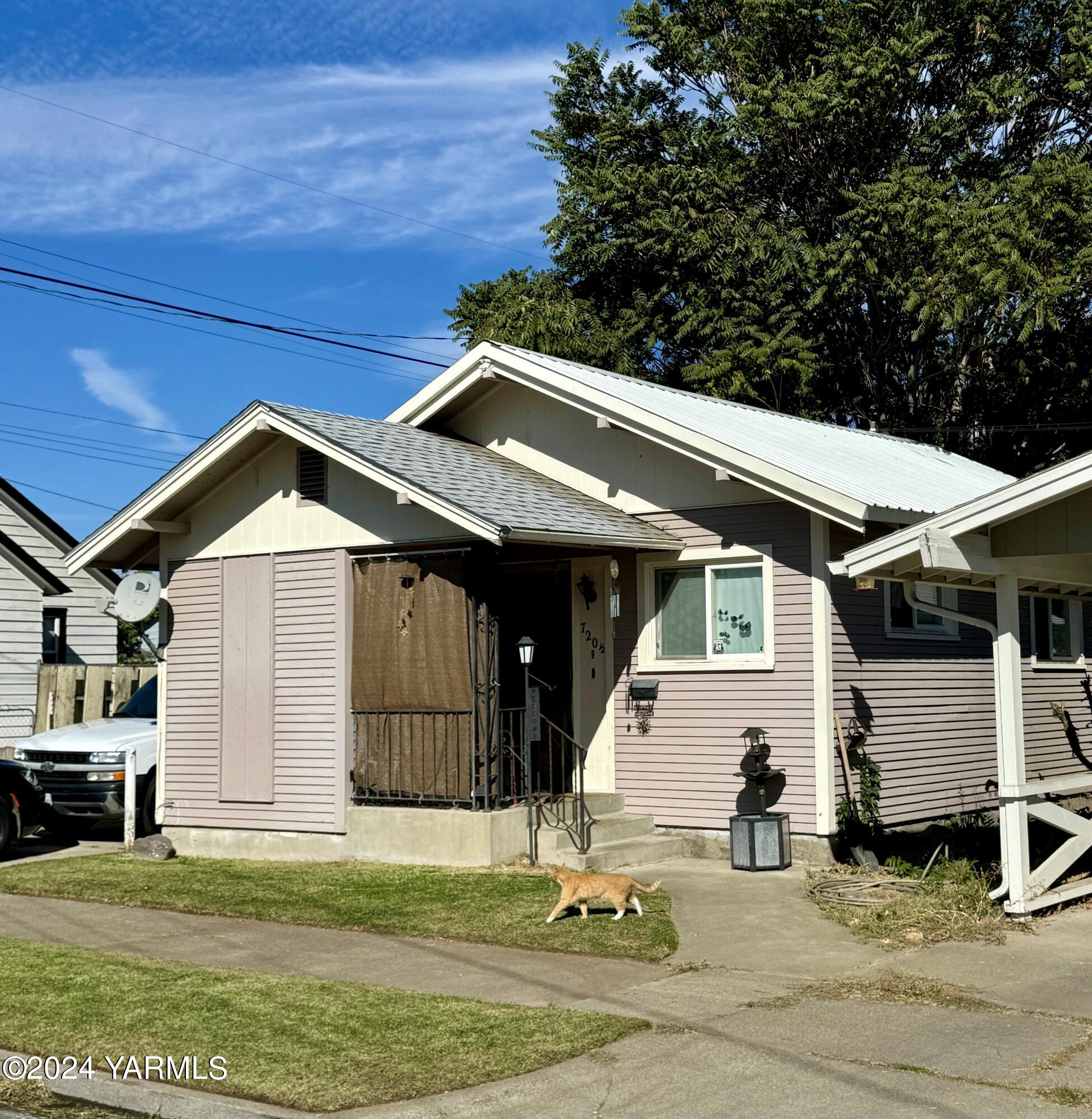 a front view of a house with a yard