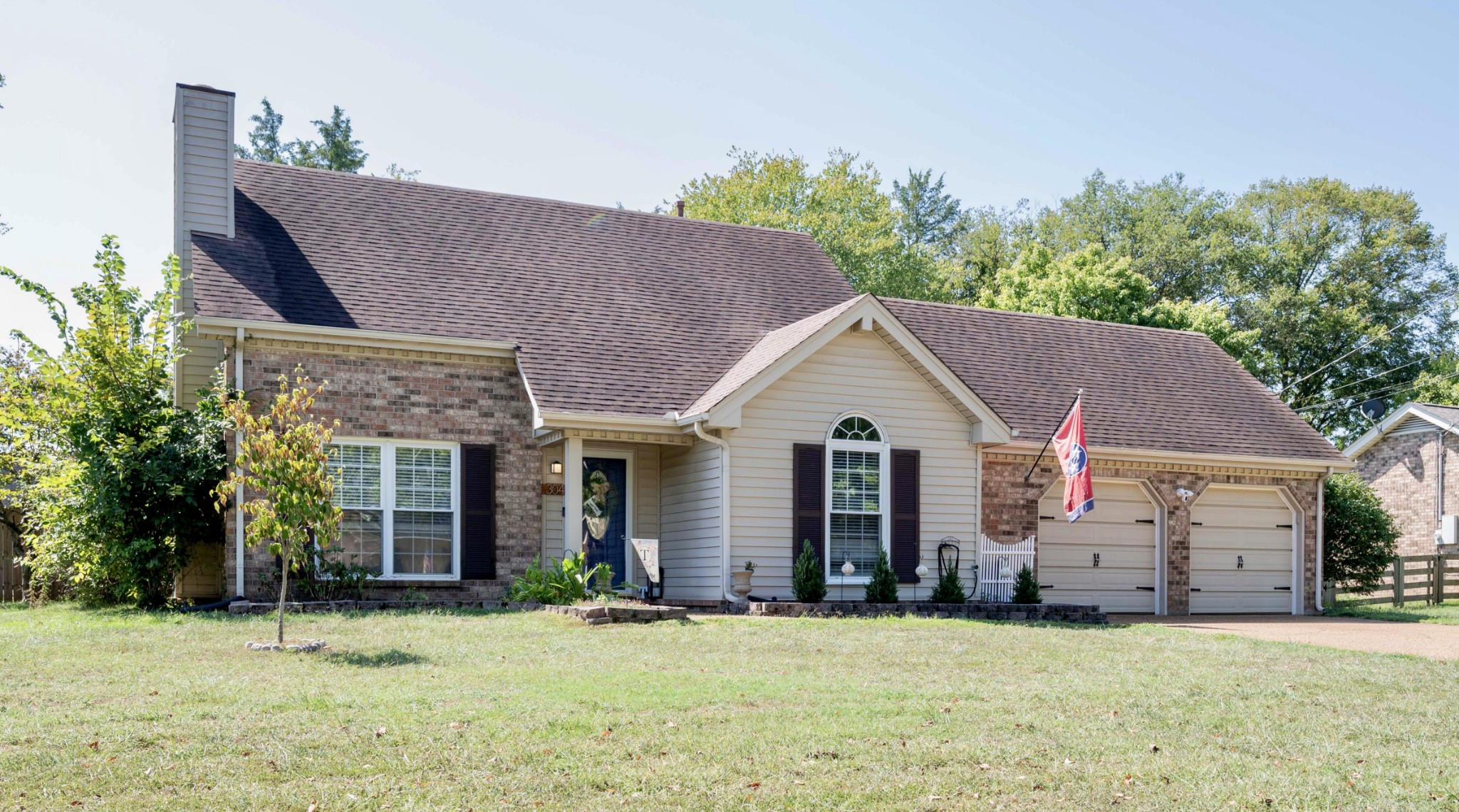 a front view of a house with a yard