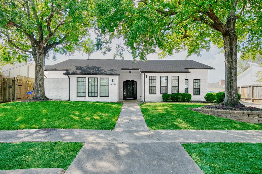 front view of a house with a garden