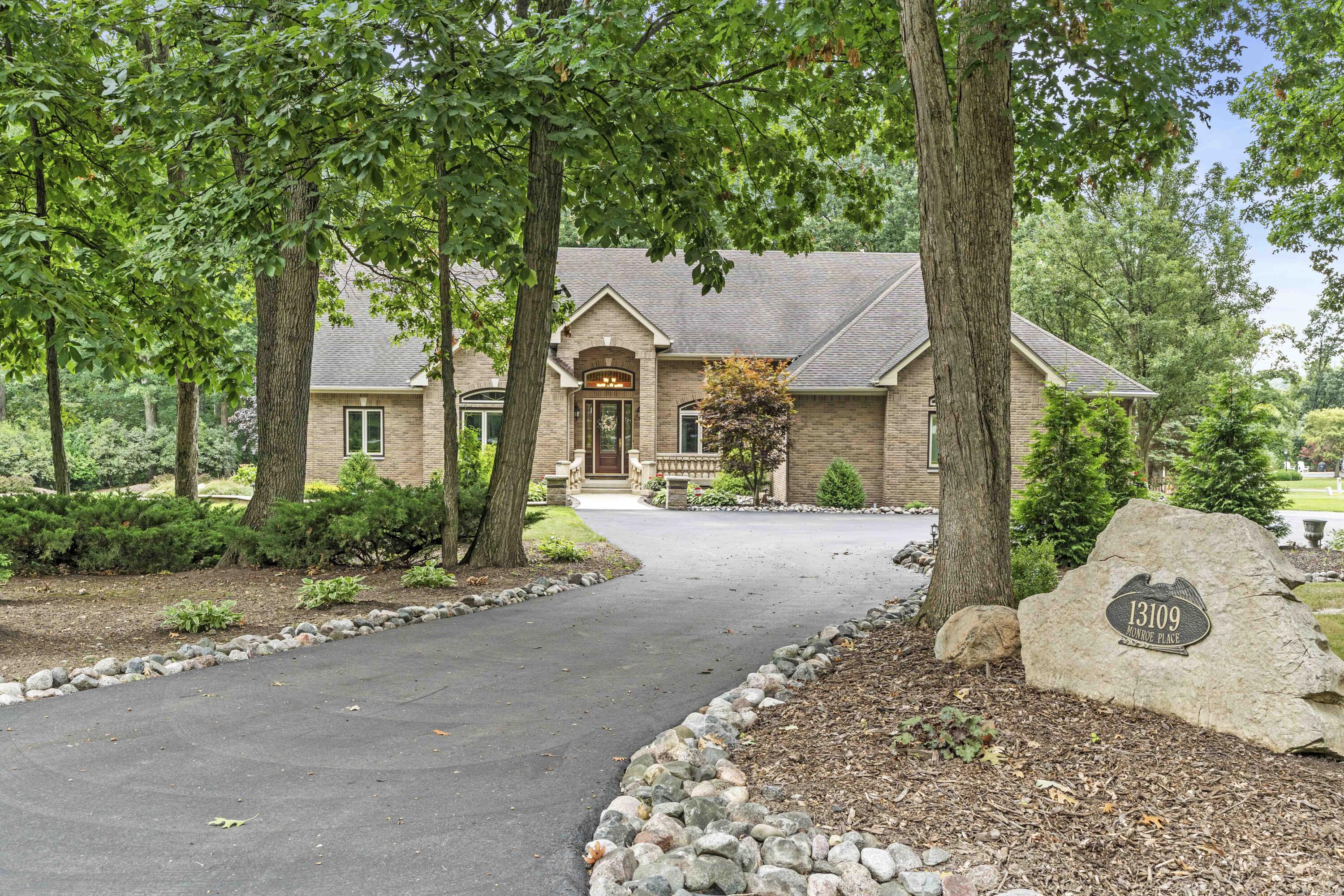 front view of a house with a tree