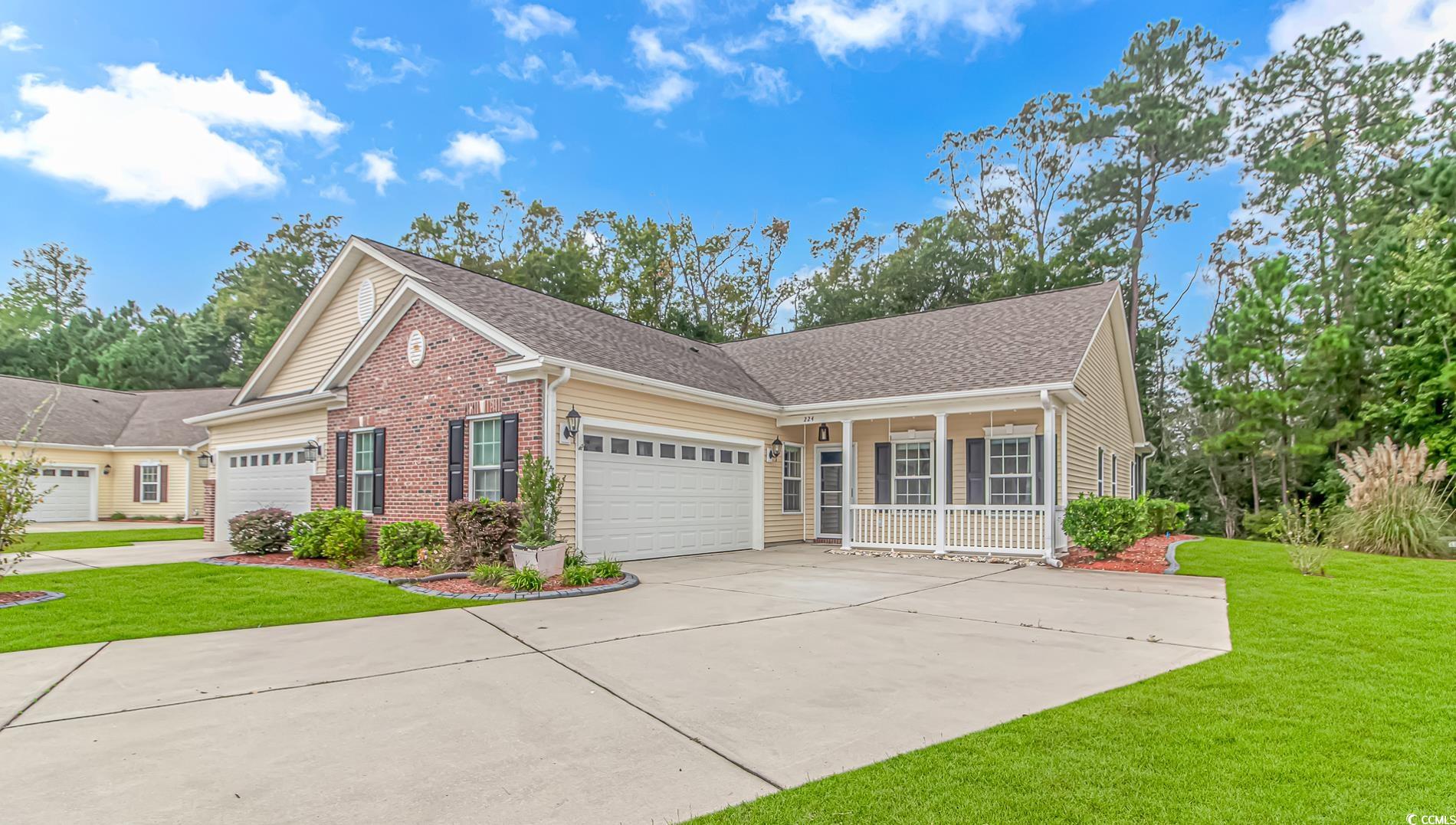 View of front of property with a front yard and a