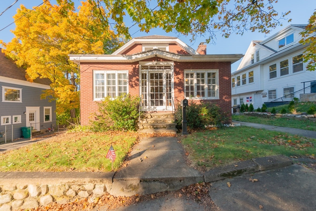 a front view of a house with a yard