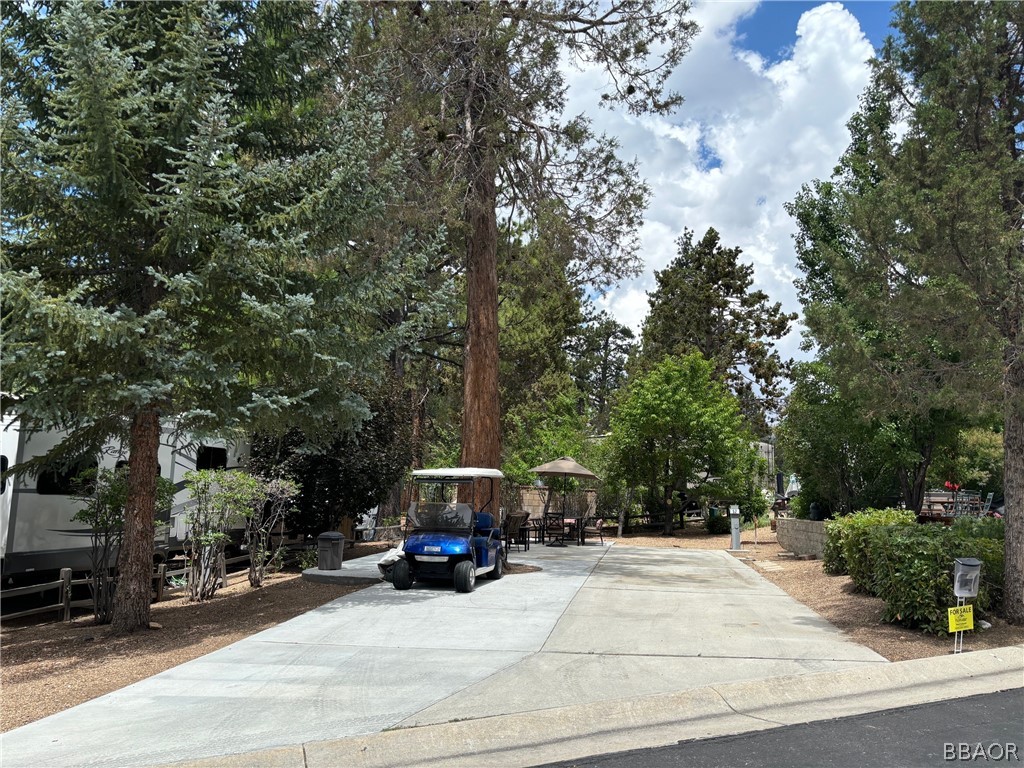 a view of a cars park on the side of a road