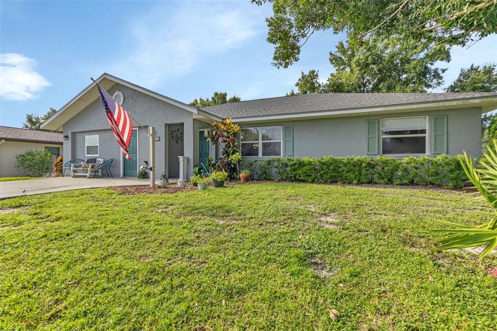 front view of a house with a yard