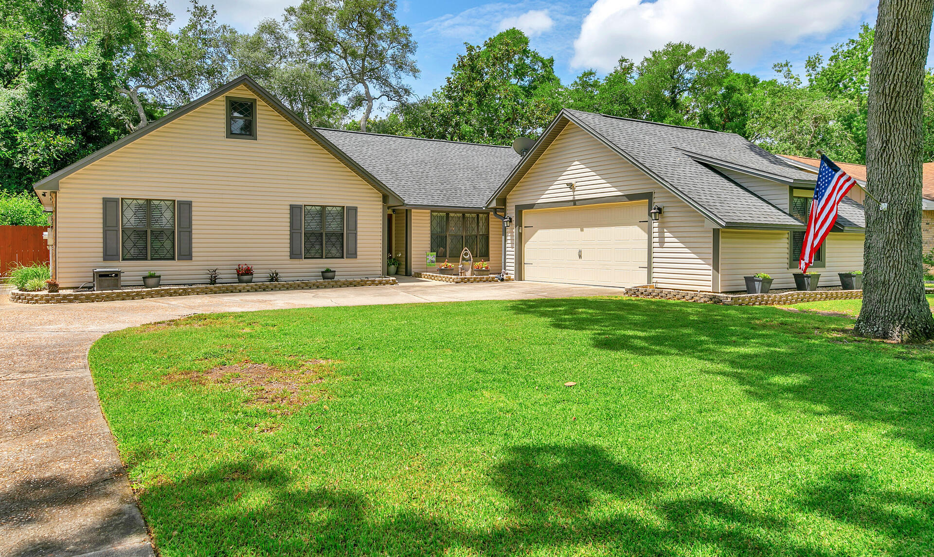 a front view of house with yard and green space