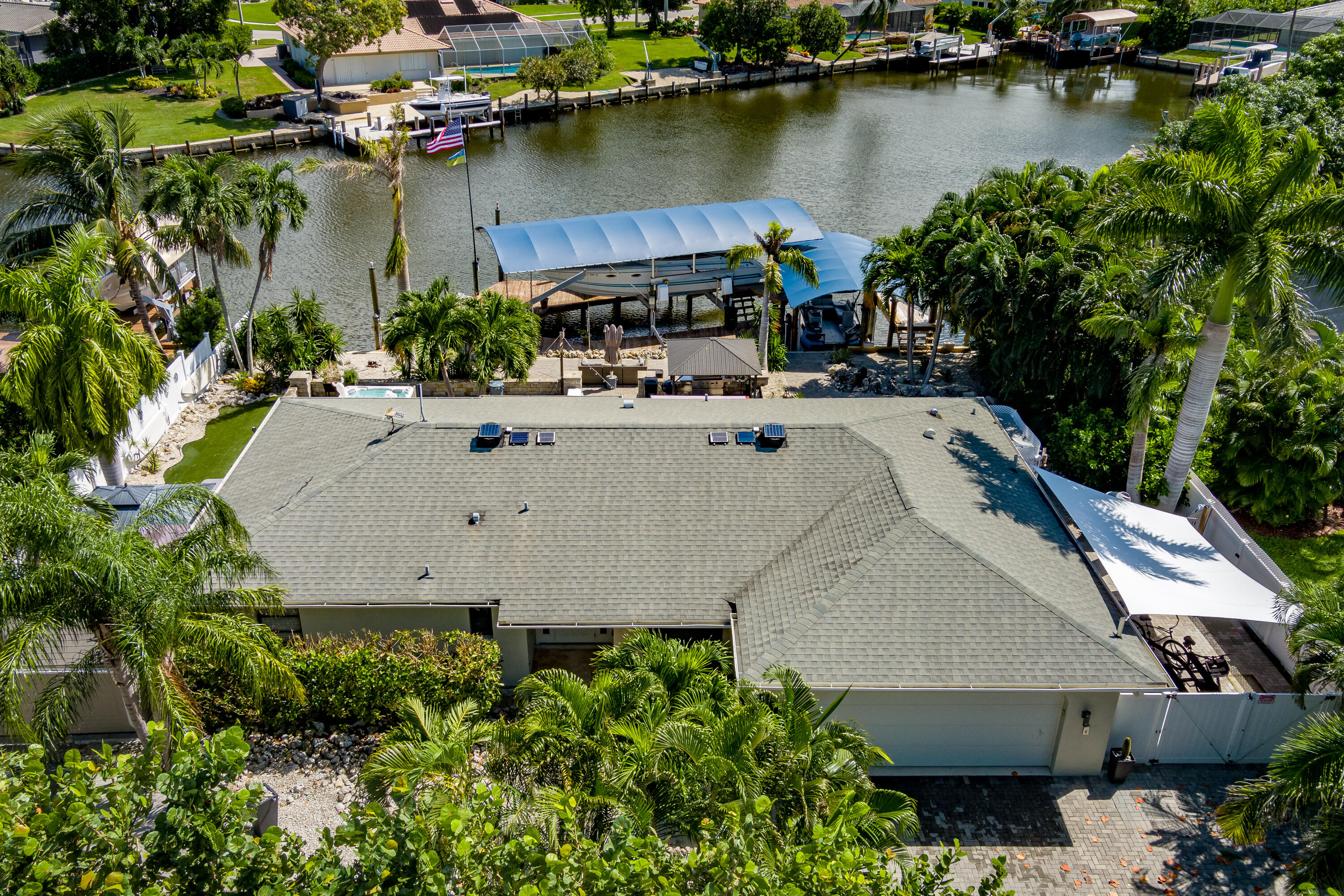 an aerial view of a house with lake view