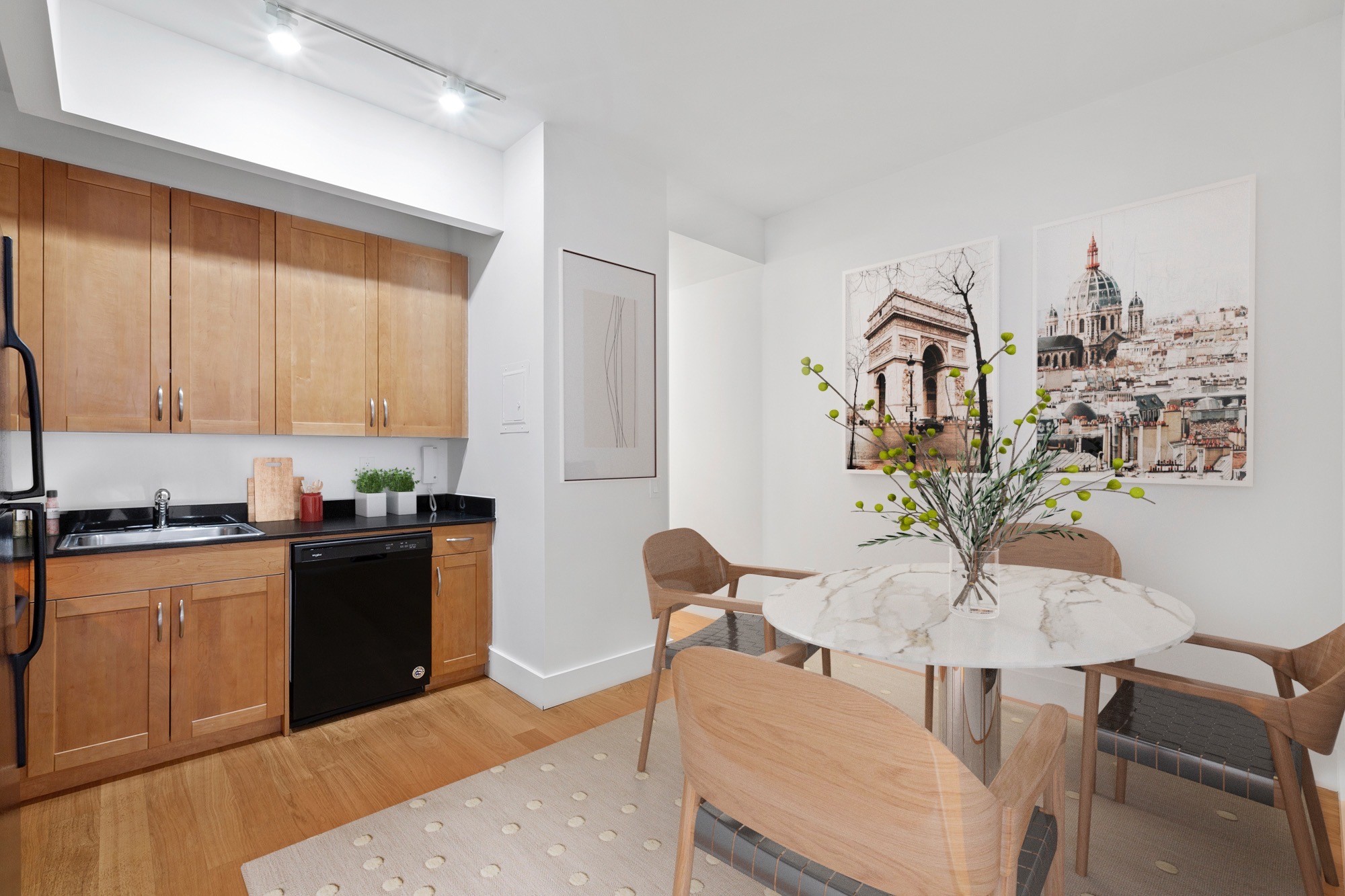 a kitchen with stainless steel appliances kitchen island granite countertop a sink and cabinets