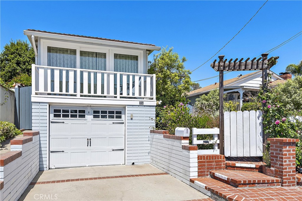 a front view of a house with a garage